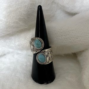 Sterling silver spoon ring with turquoise stone.